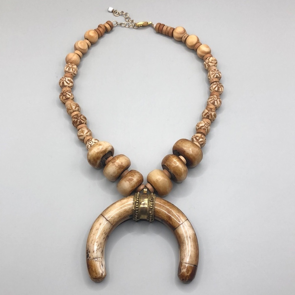 Artisan bone and wood bead statement boho festival necklace horn shape pendant.